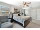 Well-lit main bedroom featuring a king-sized bed, an accent wall and an open layout at 302 Calabria Ave, Davenport, FL 33897