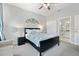 Cozy bedroom with a queen-sized bed and ensuite bathroom at 302 Calabria Ave, Davenport, FL 33897