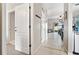 Bright hallway with neutral colors that connects to the living room and kitchen area at 302 Calabria Ave, Davenport, FL 33897