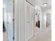 Hallway featuring closet space, white doors, and a neutral color palette at 302 Calabria Ave, Davenport, FL 33897