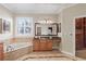 Relaxing bathroom with soaking tub, large window, and custom wood cabinets and granite countertops at 3138 Lee Shore Loop, Orlando, FL 32820