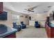 Cozy game room space with three theater chairs and a snack bar area for entertaining guests at 3138 Lee Shore Loop, Orlando, FL 32820