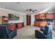 Spacious game room with kitchenette, slot machine, theater chairs, and a ceiling fan at 3138 Lee Shore Loop, Orlando, FL 32820