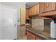 Well-equipped laundry room features ample storage and a sink area for convenience in this home at 3138 Lee Shore Loop, Orlando, FL 32820