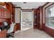 Sophisticated home office with built-in shelving and cabinetry, seamlessly flowing into the living area at 3138 Lee Shore Loop, Orlando, FL 32820