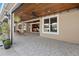 Covered patio area offering tile flooring, ceiling fans, and views of the backyard and pool at 3138 Lee Shore Loop, Orlando, FL 32820