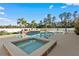 Inviting pool area with a hot tub and waterfall feature, surrounded by lush landscaping at 3138 Lee Shore Loop, Orlando, FL 32820