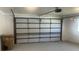 Spacious garage with an automatic door providing ample parking and storage at 33348 Tewksbury Dr, Leesburg, FL 34788