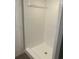 Renovated shower features tiled walls and modern fixtures at 33348 Tewksbury Dr, Leesburg, FL 34788