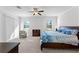 A primary bedroom boasting carpeting, a chair, and natural light with a view of the exterior at 3492 La Jolla Dr, Clermont, FL 34711