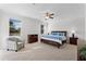 Bright and airy bedroom with plush carpeting, a ceiling fan, and furnishings at 3492 La Jolla Dr, Clermont, FL 34711