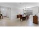 Open dining room layout features tile flooring and natural light from large window at 3492 La Jolla Dr, Clermont, FL 34711