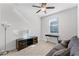 Bright room with a sofa, media console, and desk illuminated by natural light through the window at 3492 La Jolla Dr, Clermont, FL 34711