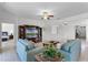 Living room with views into other rooms and stylish furniture and a ceiling fan at 3492 La Jolla Dr, Clermont, FL 34711