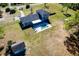 Aerial view of the property showcasing the home, pool, expansive yard, and detached structure at 36649 Forestdel Dr, Eustis, FL 32736