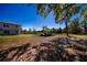 A covered outdoor area in the yard provides shade and shelter, ideal for outdoor activities and storage at 36649 Forestdel Dr, Eustis, FL 32736