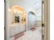 Bathroom with a vanity, mirror, cabinet lighting and a shower/bathtub combination at 36649 Forestdel Dr, Eustis, FL 32736