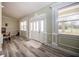 Bright foyer with elegant moldings, hardwood floors, and an inviting front door at 36649 Forestdel Dr, Eustis, FL 32736