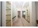 Upstairs hallway with carpet, storage and mirror. Very bright with lots of natural light at 36649 Forestdel Dr, Eustis, FL 32736