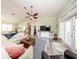 Bright living room with vaulted ceiling, fan, and sliding barn door entertainment center at 36649 Forestdel Dr, Eustis, FL 32736