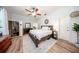 Bright main bedroom with ceiling fan, sauna, and white shiplap accent wall at 36649 Forestdel Dr, Eustis, FL 32736