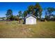 Exterior shot of shed surrounded by beautiful landscaping and space at 36649 Forestdel Dr, Eustis, FL 32736