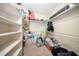 Spacious walk-in closet with ample shelving, perfect for organizing and storing belongings efficiently at 36649 Forestdel Dr, Eustis, FL 32736