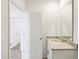 Bathroom featuring granite vanity top, undermount sink, and modern fixtures at 4973 Kaia Ave, Winter Haven, FL 33884
