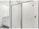 Modern bathroom with a glass-enclosed shower and granite vanity top at 4973 Kaia Ave, Winter Haven, FL 33884