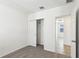 Bedroom featuring neutral carpet and closet with sliding doors at 4973 Kaia Ave, Winter Haven, FL 33884