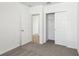 Bedroom with neutral carpet and closet with sliding doors at 4973 Kaia Ave, Winter Haven, FL 33884