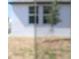 An exterior shot showing a blurred view of the side of a house on a sunny day at 4973 Kaia Ave, Winter Haven, FL 33884
