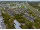 Aerial view of community featuring multiple units, parking and surrounding roads at 5481 Limestone Ln # 5481, Lakeland, FL 33809