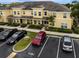 Aerial view of a townhome complex with assigned parking, neat landscaping, and well-maintained surroundings at 5481 Limestone Ln # 5481, Lakeland, FL 33809