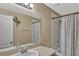 Bathroom features a vanity, mirror, shower, and tub combination with neutral-colored decor at 5481 Limestone Ln # 5481, Lakeland, FL 33809