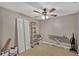 Carpeted empty bedroom featuring ceiling fan, closet, and a ladder with assorted tools at 5481 Limestone Ln # 5481, Lakeland, FL 33809