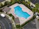 Aerial view of refreshing community pool with lounge chairs and seating areas at 5481 Limestone Ln # 5481, Lakeland, FL 33809