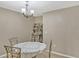 Traditional dining area with round table and view of decorative shelves at 5481 Limestone Ln # 5481, Lakeland, FL 33809