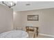 Light-filled dining area showcases a glass-top console table and a round dining table at 5481 Limestone Ln # 5481, Lakeland, FL 33809