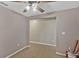 The carpeted living area is bright and ready for furniture at 5481 Limestone Ln # 5481, Lakeland, FL 33809