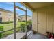 Screened patio with a view of community lawn and manicured shrubbery at 5481 Limestone Ln # 5481, Lakeland, FL 33809