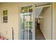 Open sliding glass door with vertical blinds leading to outdoor patio at 5481 Limestone Ln # 5481, Lakeland, FL 33809