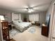 Bedroom with a ceiling fan, bed and desk at 63 Dahlia Dr, Debary, FL 32713