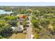 Expansive aerial view of a Eustis home, showcasing a long driveway and lush green surroundings at 780 Old Mount Dora Rd, Eustis, FL 32726