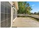 Wooden back deck with a screened back door and a view of the yard at 780 Old Mount Dora Rd, Eustis, FL 32726