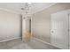 Neutral bedroom features gray carpet, door to the hallway, and white ceiling fan at 780 Old Mount Dora Rd, Eustis, FL 32726