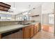 Kitchen sink and countertop, with stainless steel appliances, and a view into the living room at 780 Old Mount Dora Rd, Eustis, FL 32726