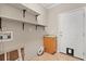 Laundry room with shelving and a utility sink hookup near the back door at 780 Old Mount Dora Rd, Eustis, FL 32726