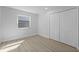 Neutral bedroom with wood-style flooring, closet, and window, offering a serene space at 822 Swaying Palm Dr, Apopka, FL 32712