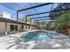 Screened pool and spa area featuring a spacious deck, ideal for relaxation and outdoor gatherings at 822 Swaying Palm Dr, Apopka, FL 32712